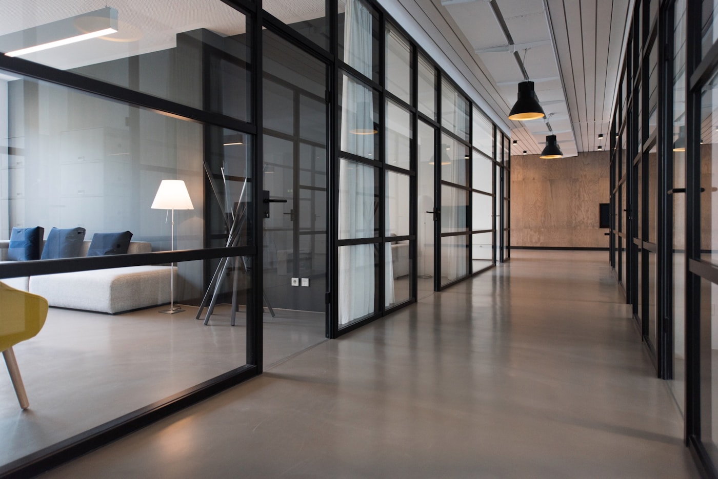 Plant-filled office with green accents and shared desks