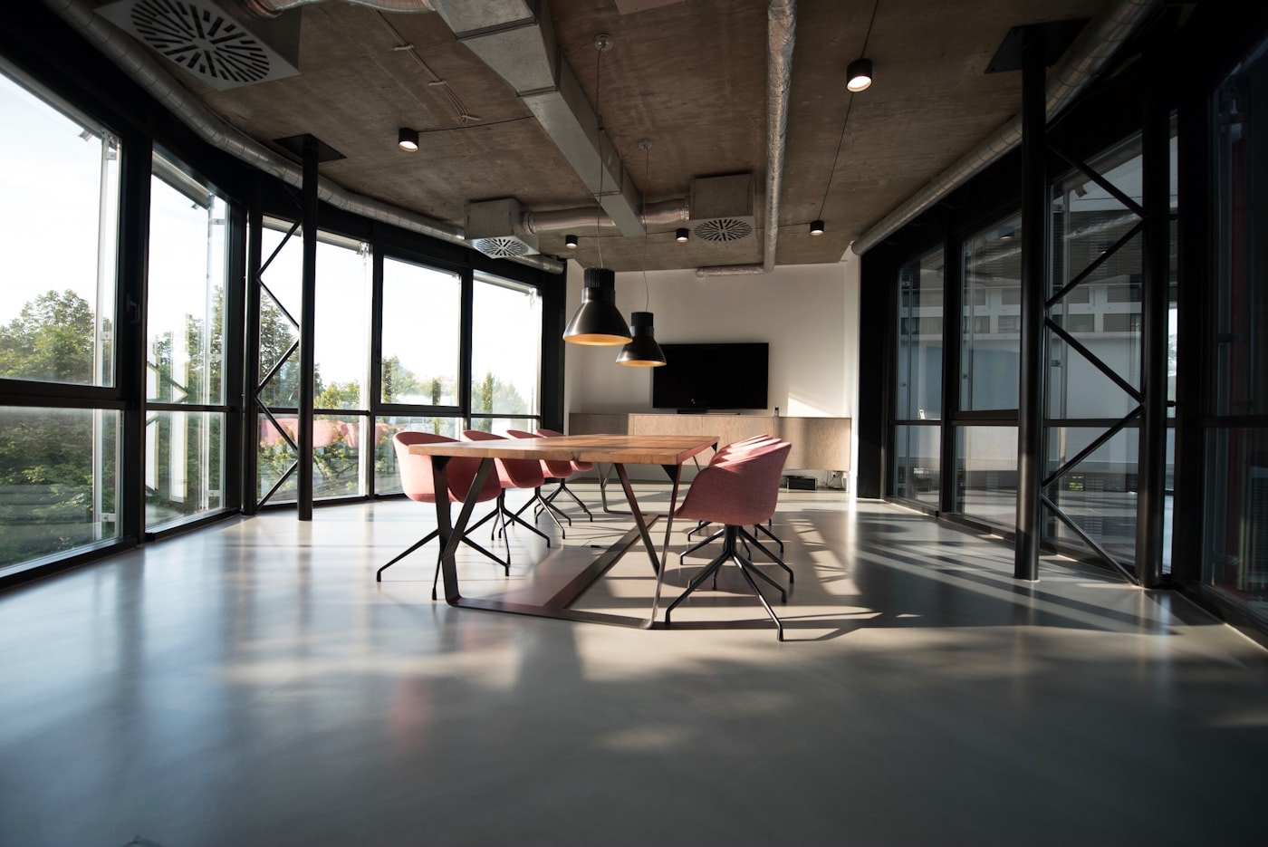 Warm contemporary workspace with wood furniture and soft lighting